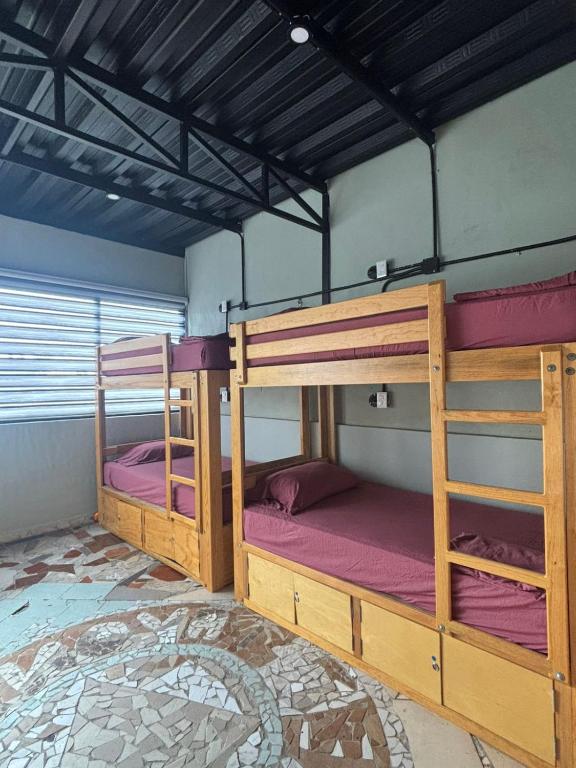 Postel nebo postele na pokoji v ubytování Canova Hostel & Pizza