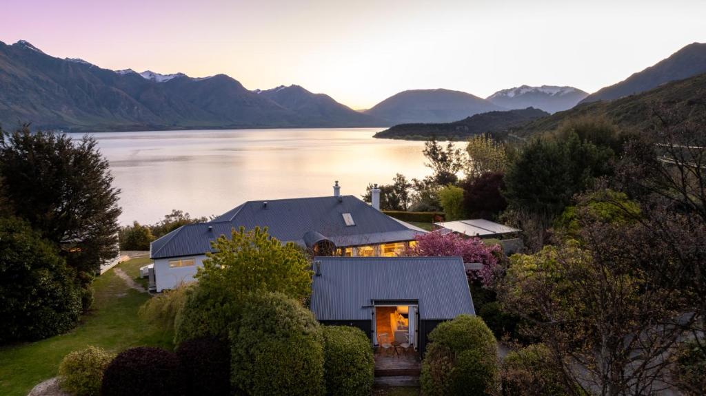 an aerial view of a house next to a lake at Baywaters Retreat by Sothebys Luxury Rental Homes in Closeburn