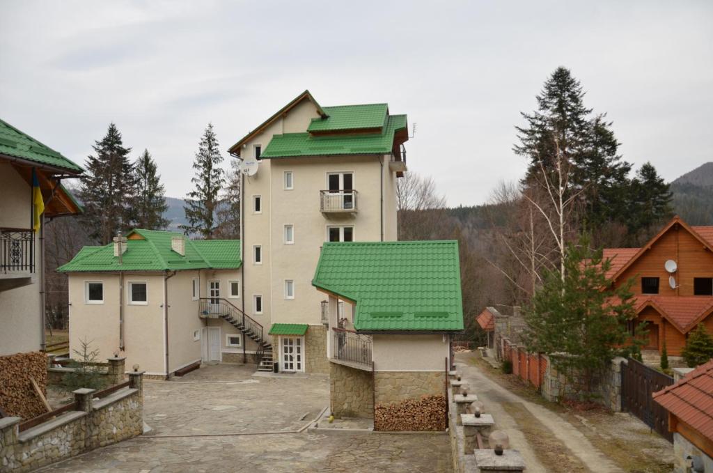 a group of buildings with green roofs at Sofia Forest Club in Yaremche