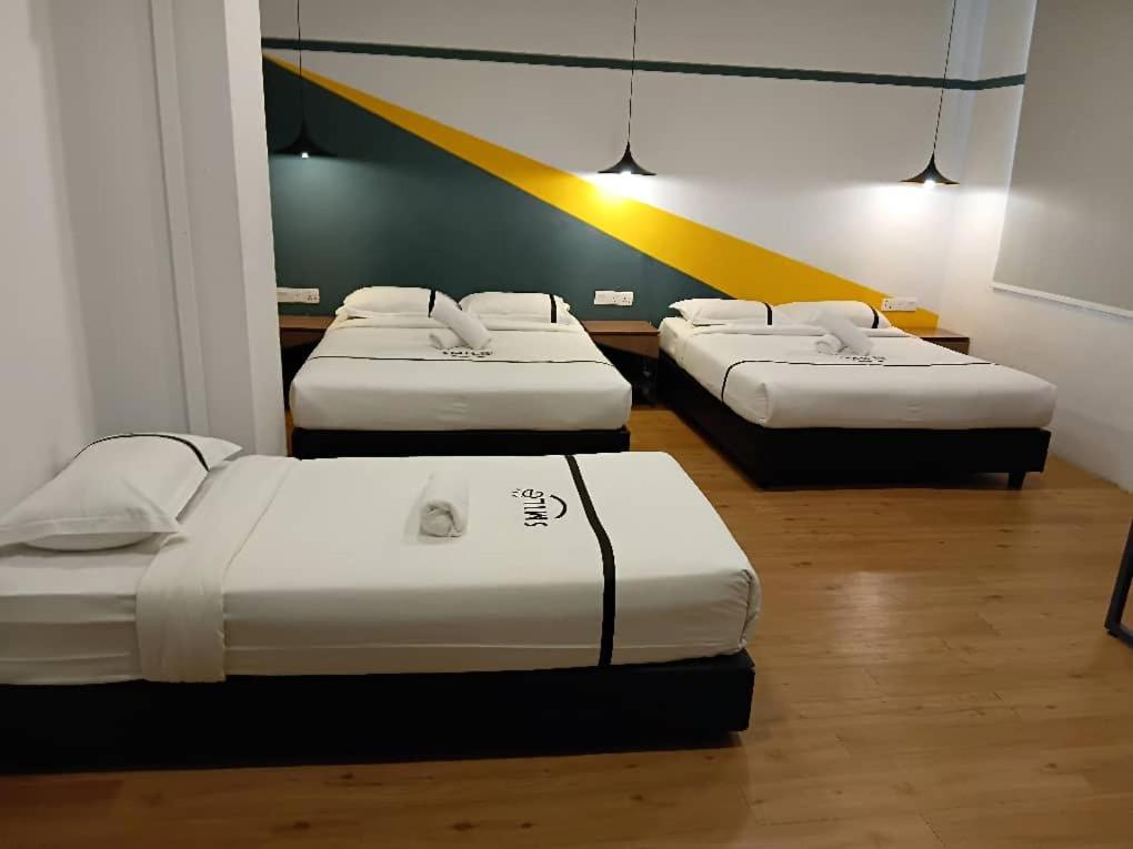 Postel nebo postele na pokoji v ubytování Smile Hotel Putrajaya
