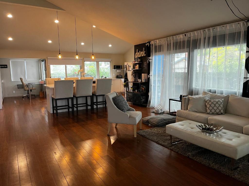 a living room with a couch and a dining room at Spacious Home Steps from Huge Park and Outdoor Fun in San Jose