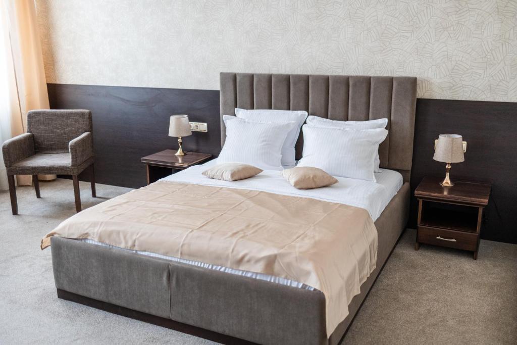 Postel nebo postele na pokoji v ubytování Hotel Neptun