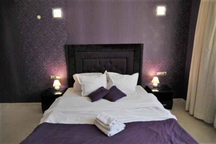 Postel nebo postele na pokoji v ubytování Hotel Neptun
