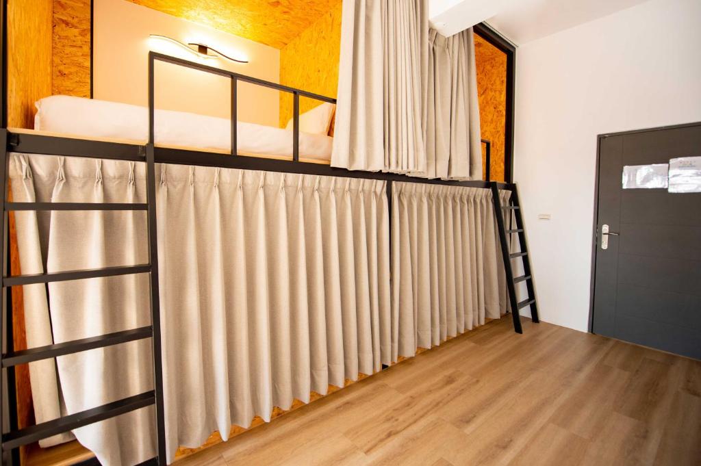 Ένα ή περισσότερα κρεβάτια σε δωμάτιο στο Chao Hostel