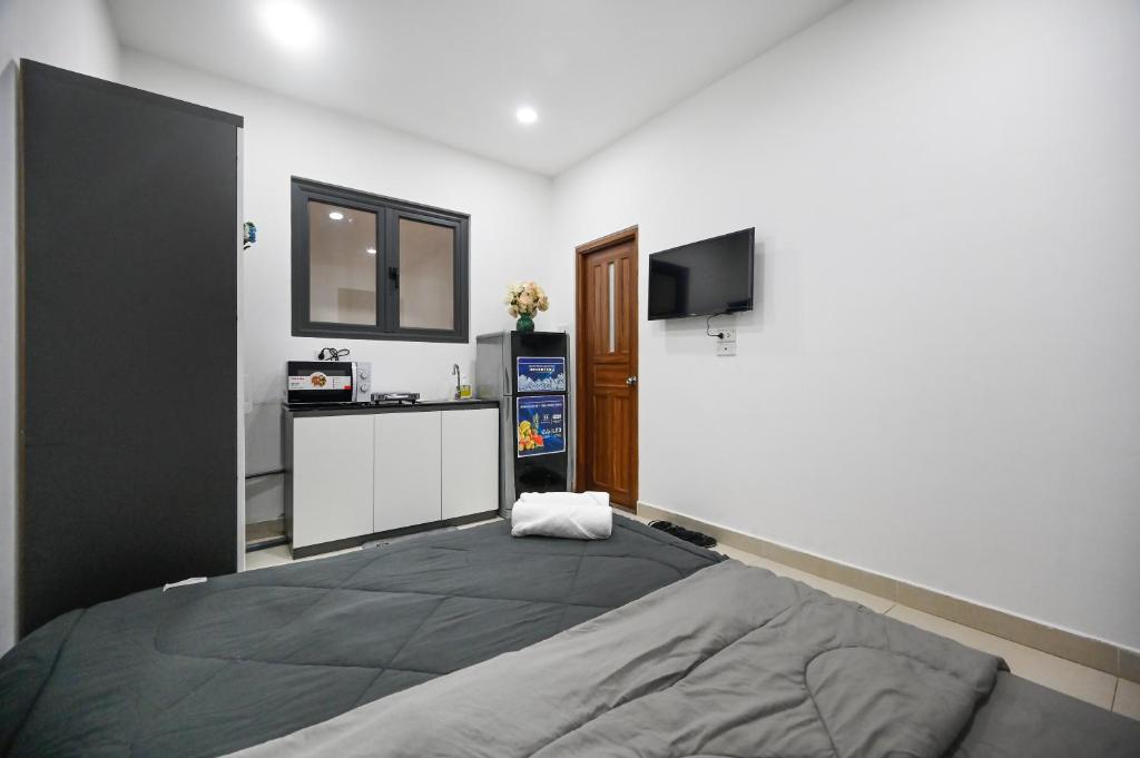 TV a/nebo společenská místnost v ubytování Bear's House Sư Vạn Hạnh