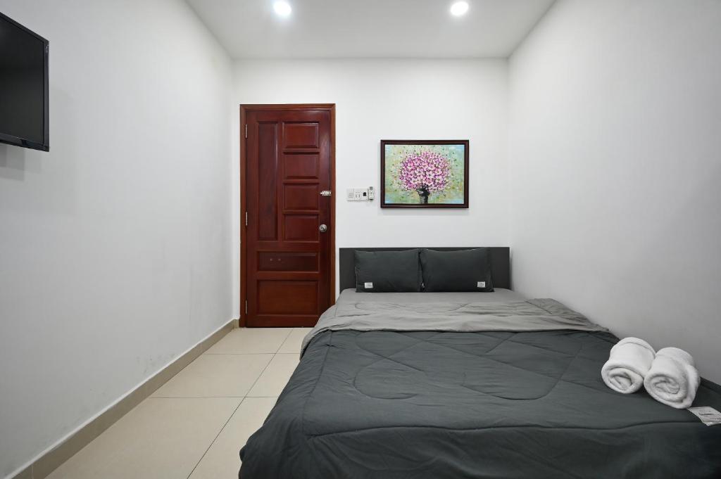 Postel nebo postele na pokoji v ubytování Bear's House Sư Vạn Hạnh