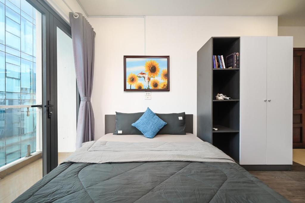 Postel nebo postele na pokoji v ubytování Bear's House Sư Vạn Hạnh
