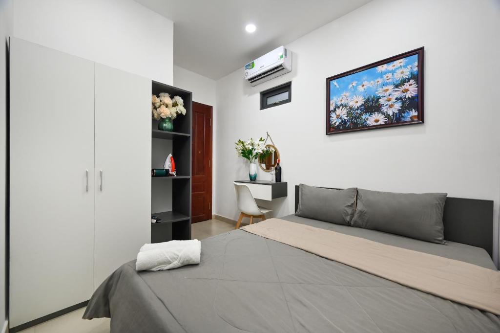 Postel nebo postele na pokoji v ubytování Bear's House Sư Vạn Hạnh