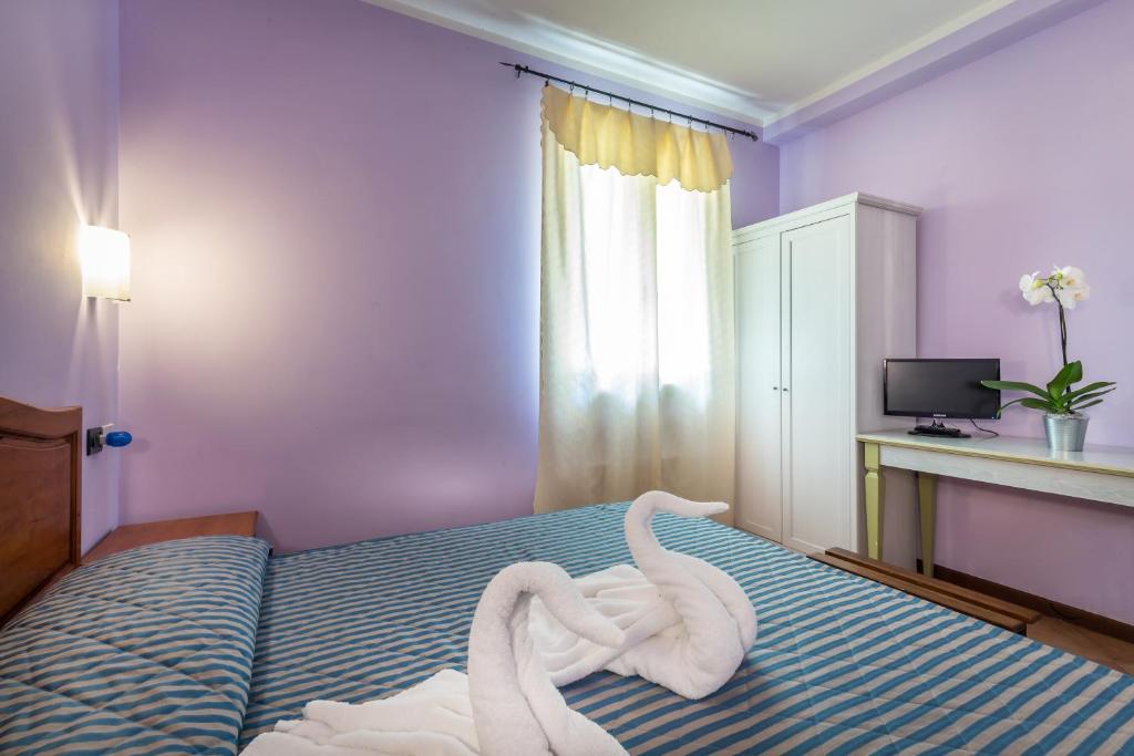 Postel nebo postele na pokoji v ubytování Hotel Real
