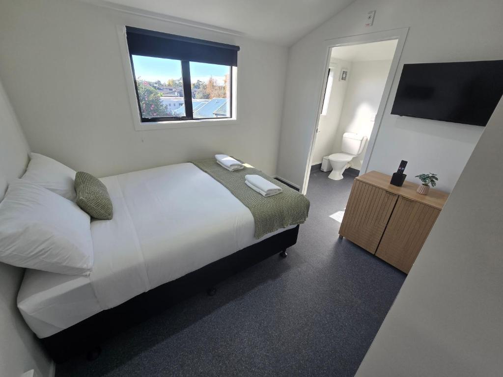 Postel nebo postele na pokoji v ubytování Microtel Lodge