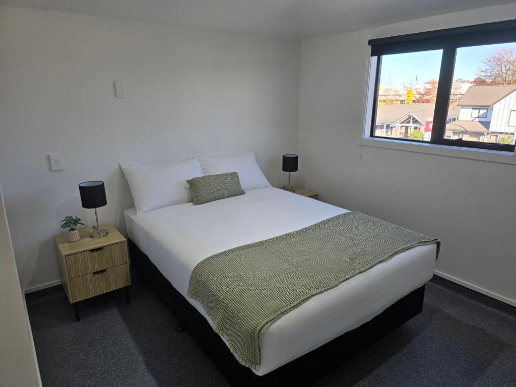 Postel nebo postele na pokoji v ubytování Microtel Lodge