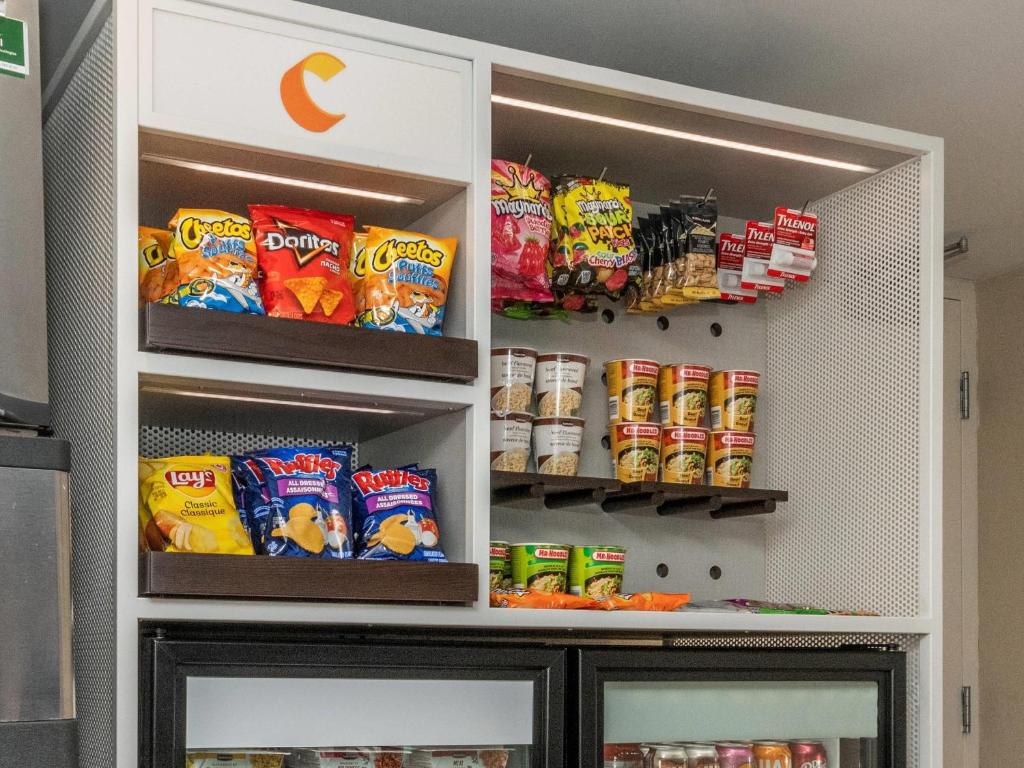 a refrigerator filled with lots of different types of snacks at Comfort Inn in Ottawa