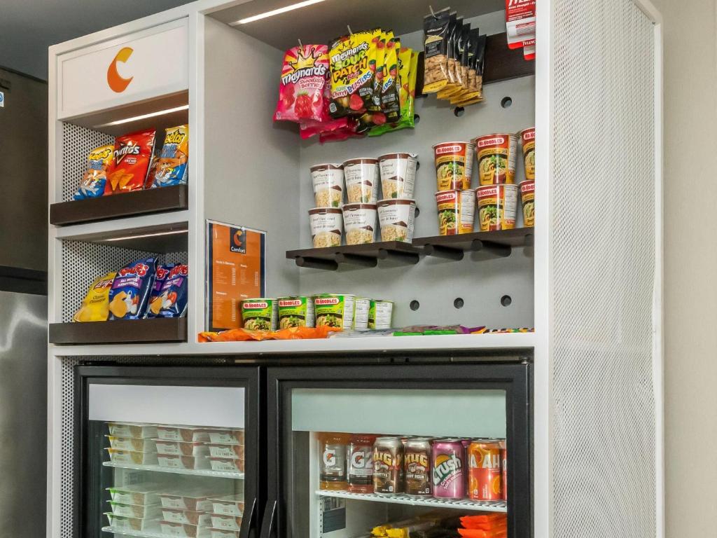 a refrigerator filled with lots of food and drinks at Comfort Inn in Ottawa