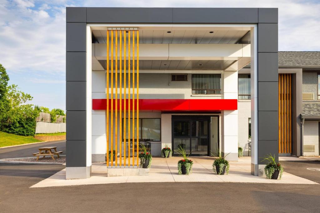 a building with yellow and red columns at Comfort Inn in Charlottetown