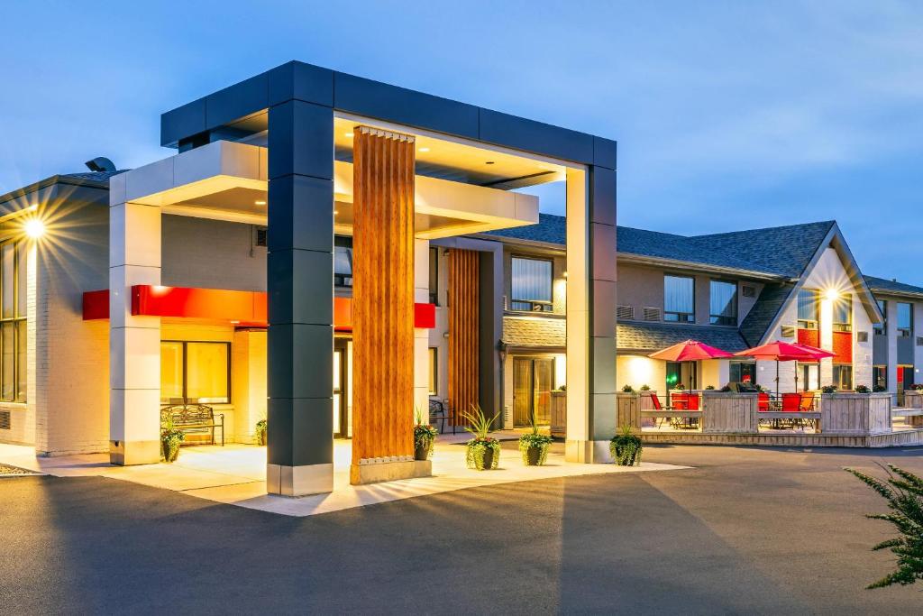a building with columns and a restaurant in the background at Comfort Inn in Charlottetown