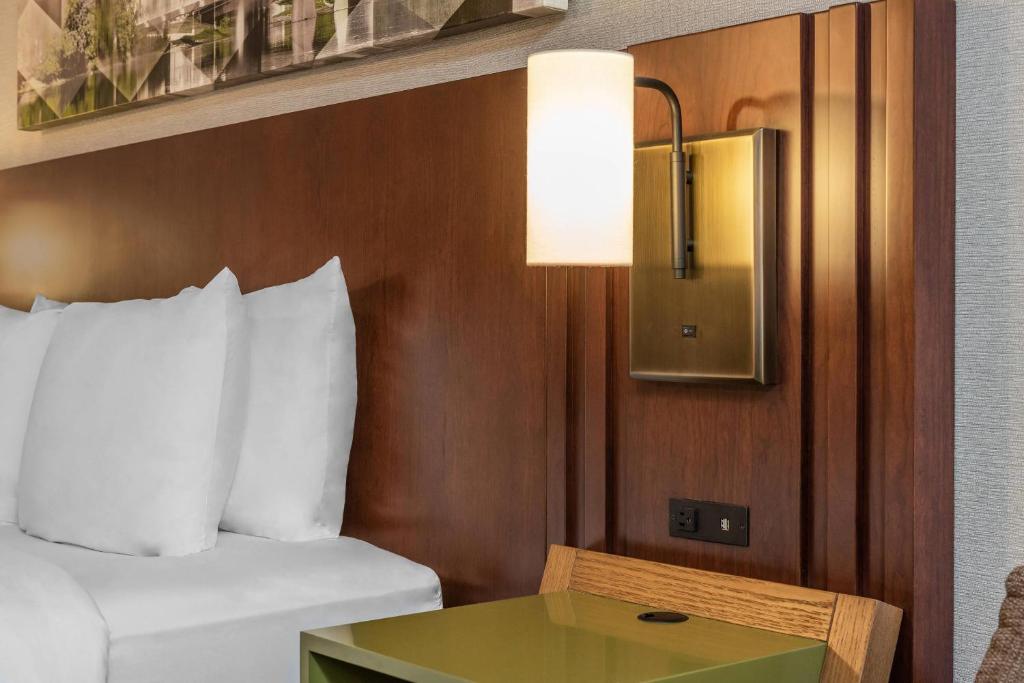 a hotel room with a bed and a table at Comfort Inn in Charlottetown