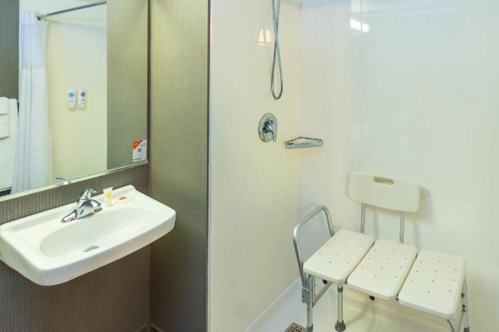 a bathroom with a sink and a shower at Comfort Inn in Charlottetown