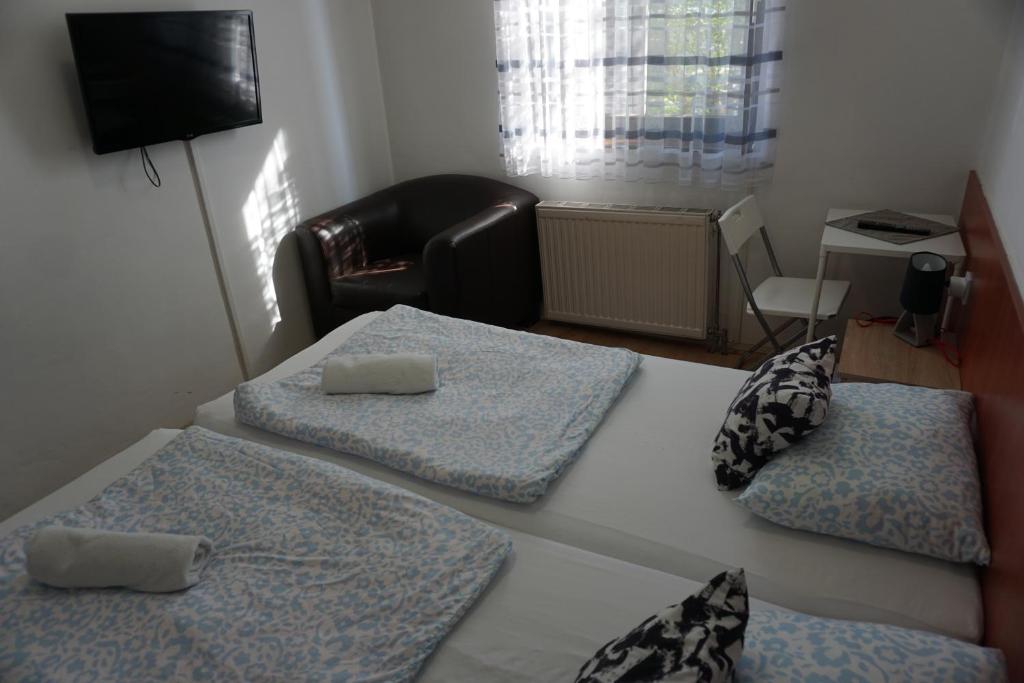 Postel nebo postele na pokoji v ubytování Május 1 Vendégház - Torony