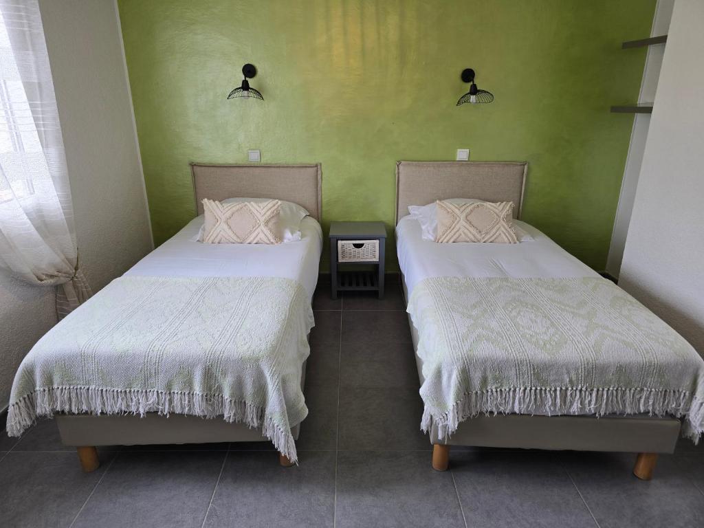 Postel nebo postele na pokoji v ubytování Le Mas des Quintrands Manosque - Motel de charme