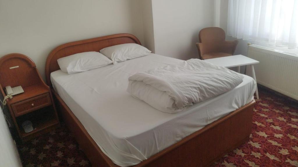 Postel nebo postele na pokoji v ubytování Hotel Birkent