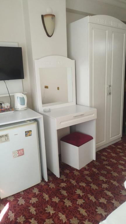 Postel nebo postele na pokoji v ubytování Hotel Birkent