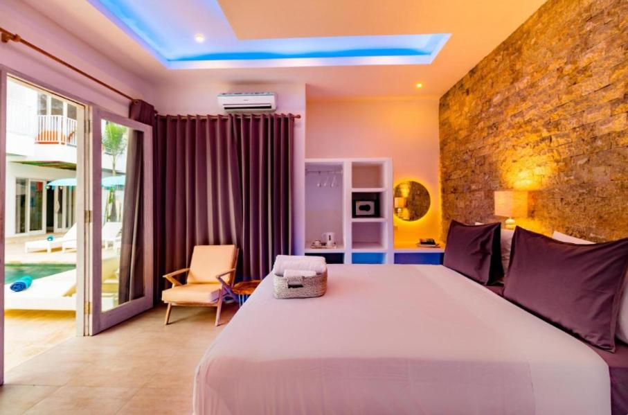Postel nebo postele na pokoji v ubytování Cocotoa Boutique Hotel & Villa