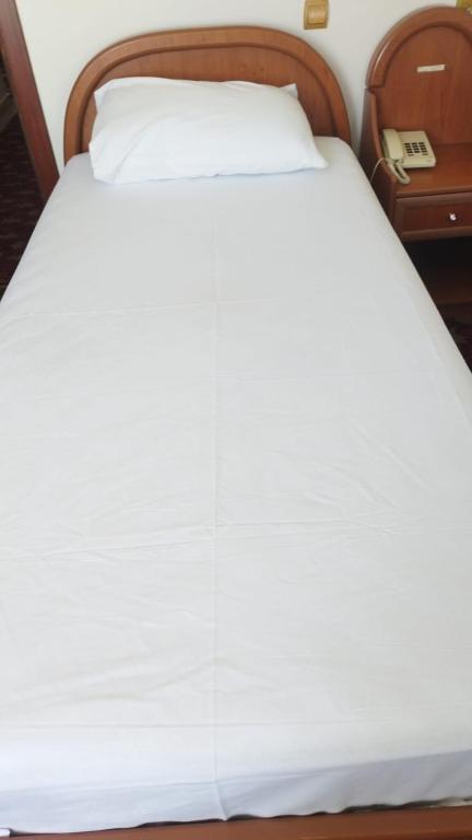 Postel nebo postele na pokoji v ubytování Hotel Birkent