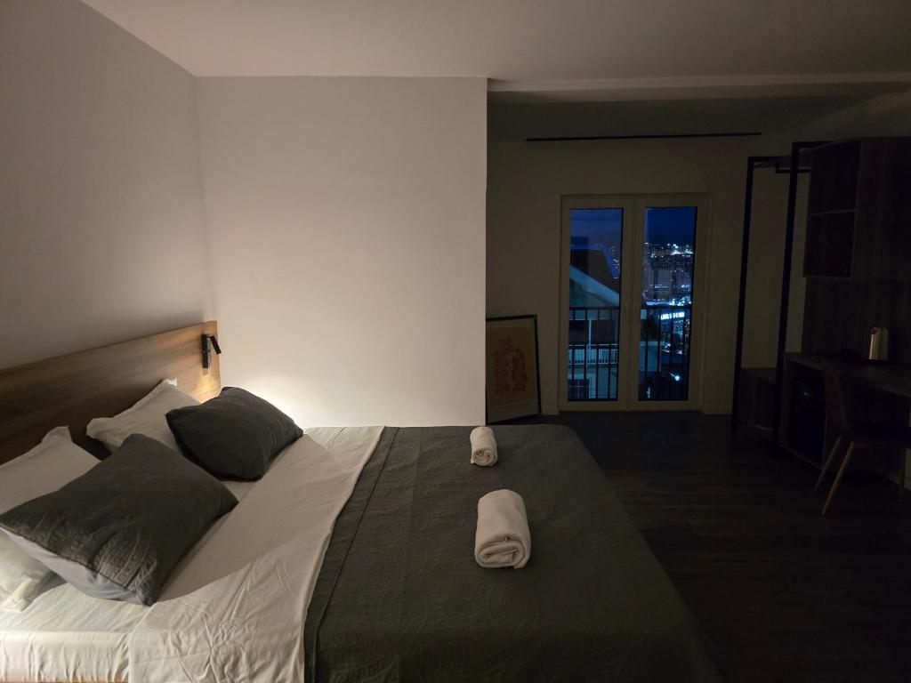 Postel nebo postele na pokoji v ubytování Fole Apart Hotel