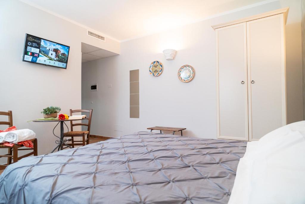 Postel nebo postele na pokoji v ubytování Il Marchese Hotel & Spa