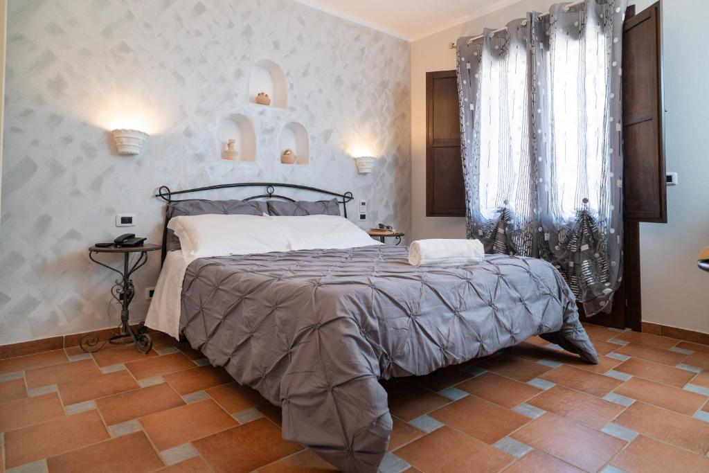 Postel nebo postele na pokoji v ubytování Il Marchese Hotel & Spa