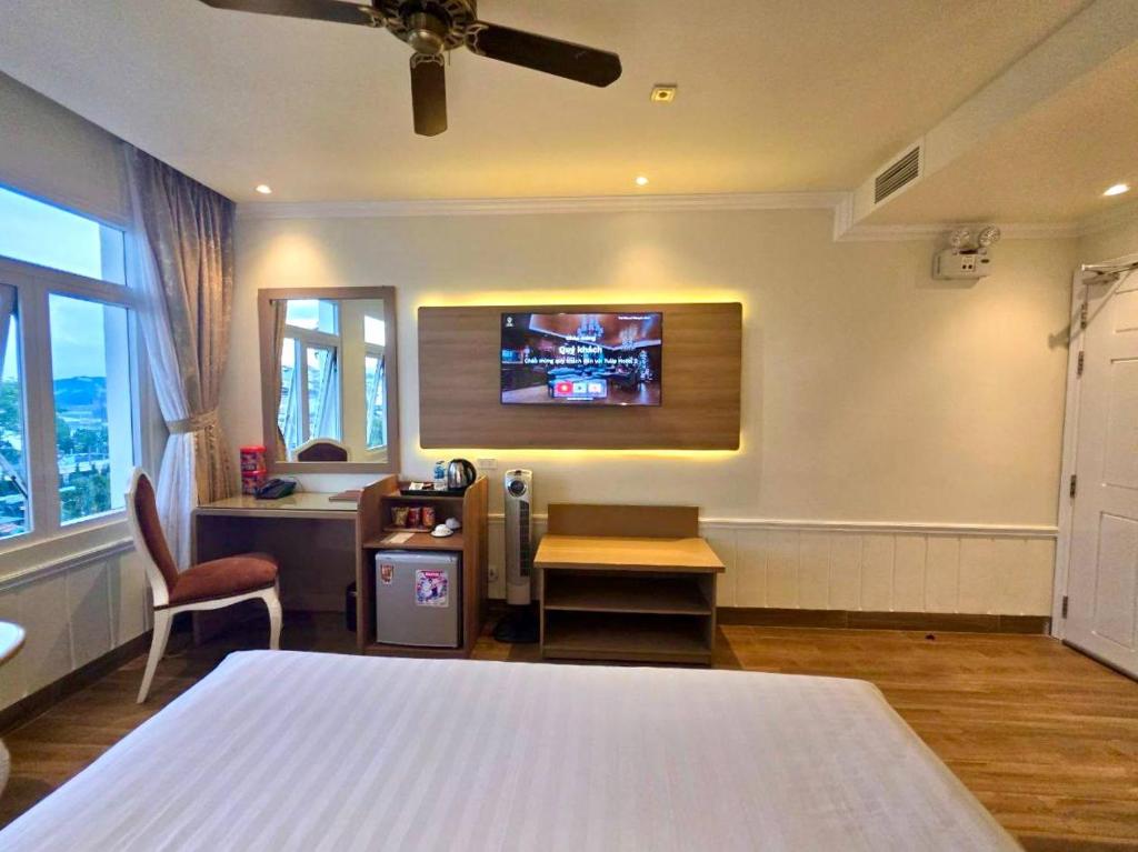 Postel nebo postele na pokoji v ubytování Tulip Hotel 2