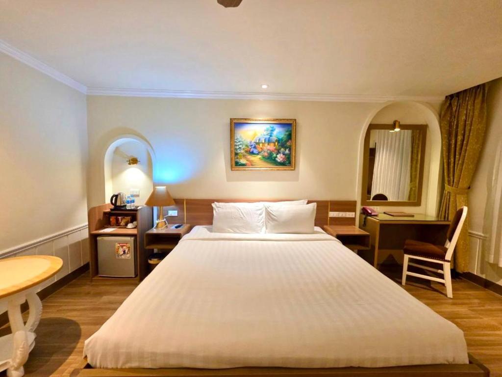 Postel nebo postele na pokoji v ubytování Tulip Hotel 2