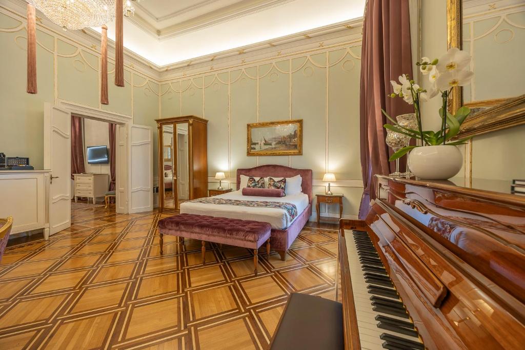 Posteľ alebo postele v izbe v ubytovaní Palazzo Monga Boutique Guesthouse