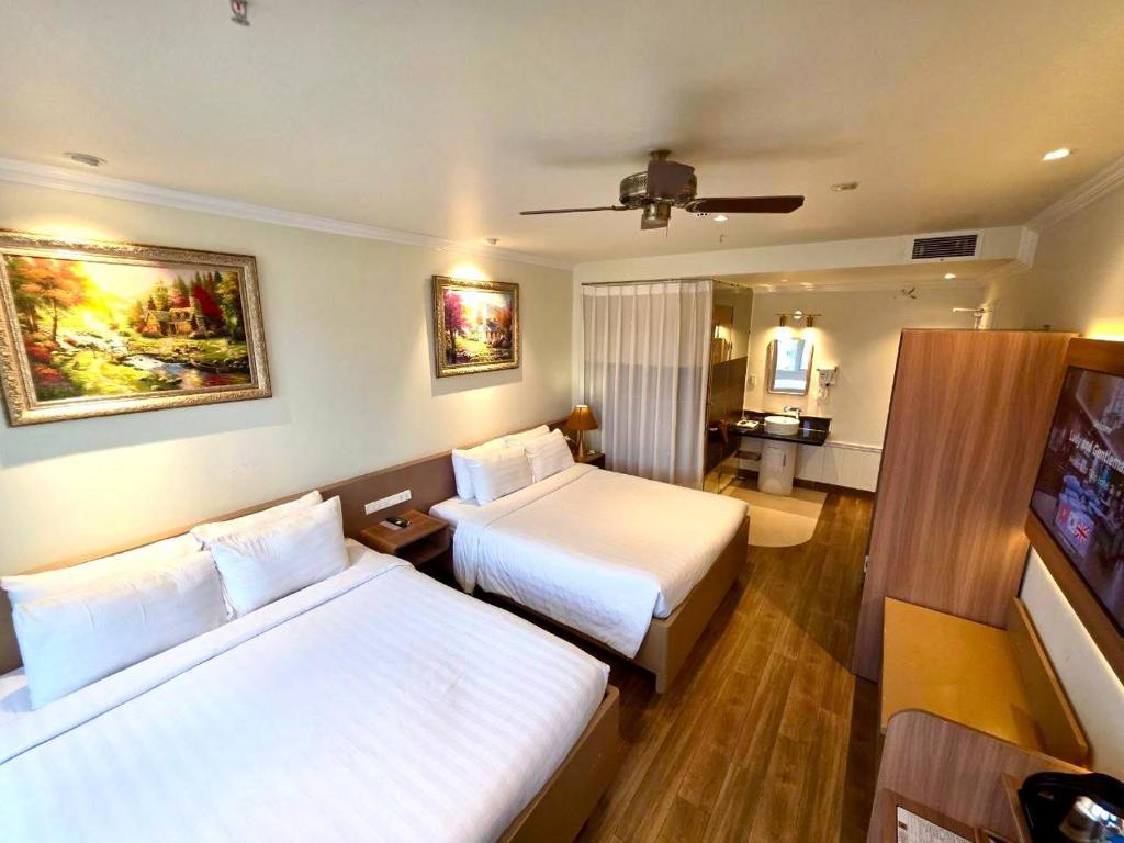 Postel nebo postele na pokoji v ubytování Tulip Hotel 2
