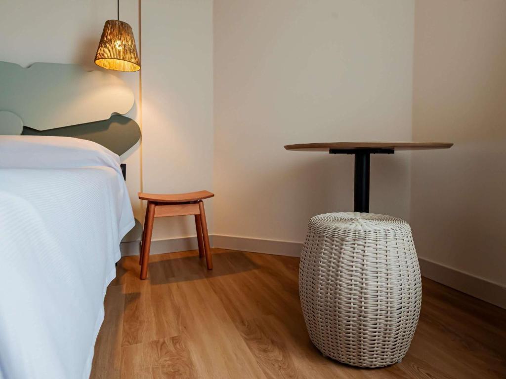 Postel nebo postele na pokoji v ubytování Ibis Styles Maragogi - O primeiro Ibis Styles pé na areia do Brasil