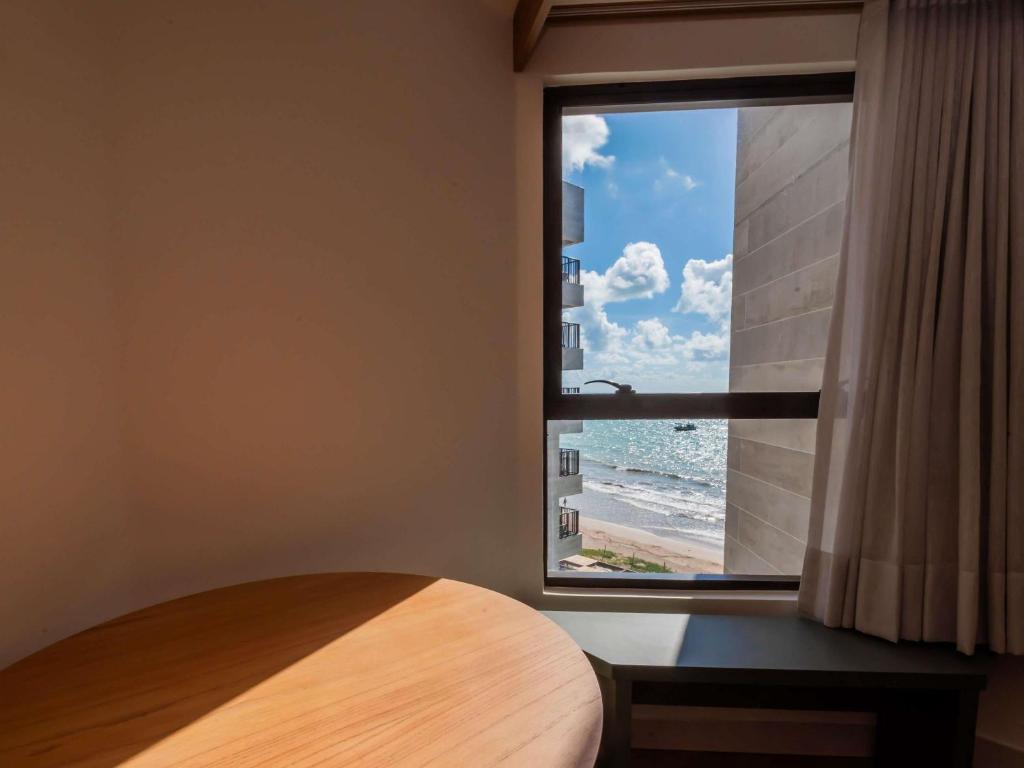 Postel nebo postele na pokoji v ubytování Ibis Styles Maragogi - O primeiro Ibis Styles pé na areia do Brasil