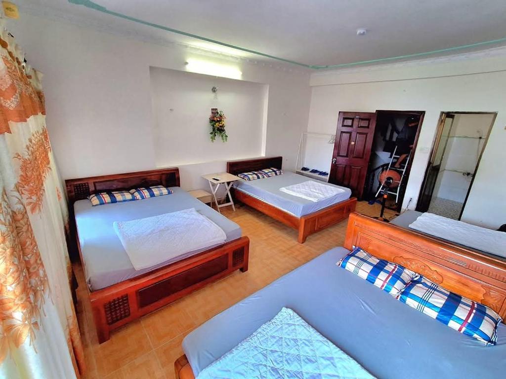 Postel nebo postele na pokoji v ubytování Nhím biển