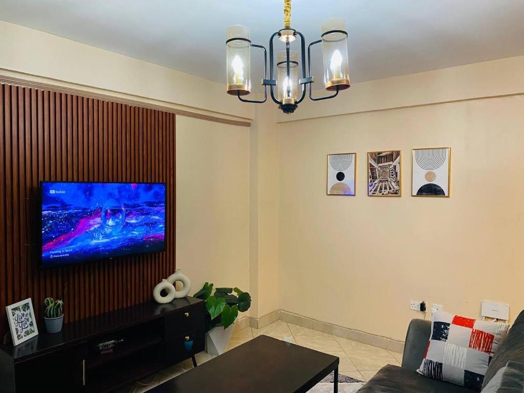 TV a/nebo společenská místnost v ubytování M&J Homes