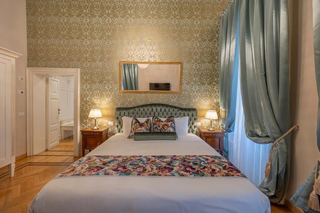 Posteľ alebo postele v izbe v ubytovaní Palazzo Monga Boutique Guesthouse