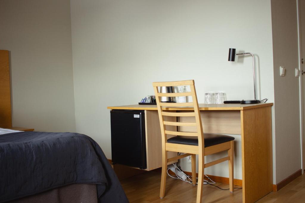Postel nebo postele na pokoji v ubytování Hornavan Hotell