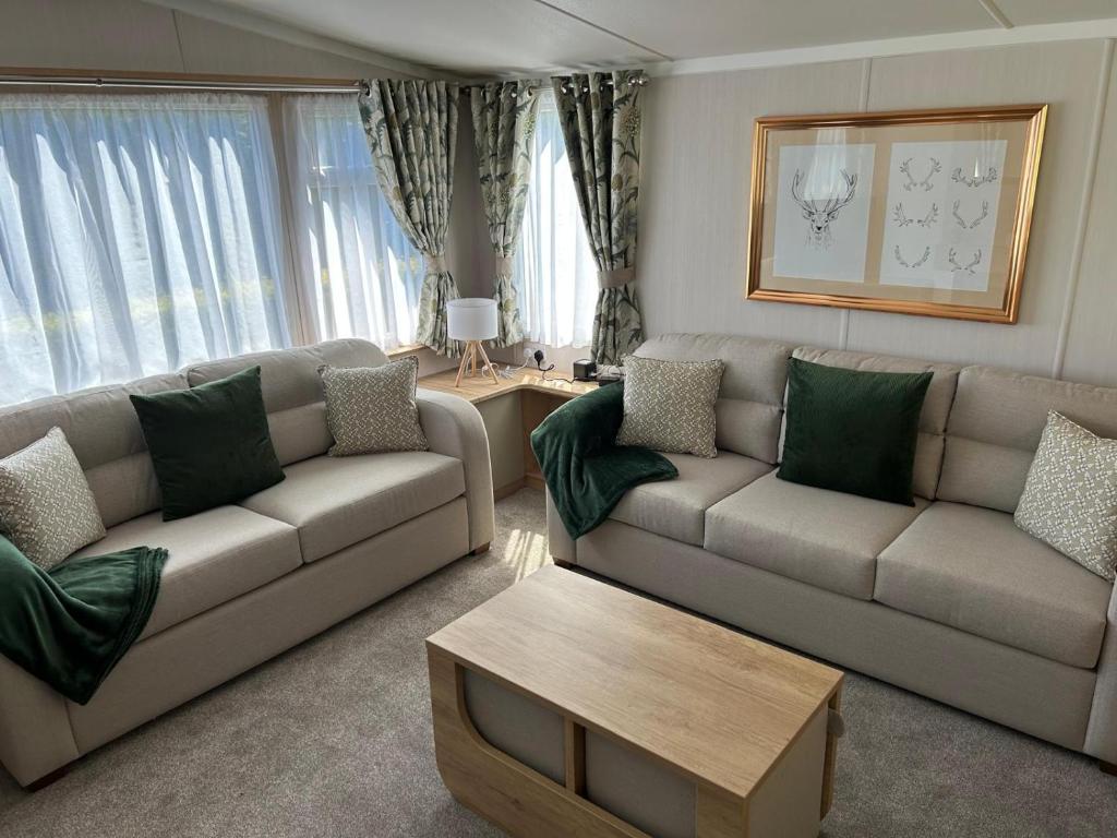 a living room with two couches and a coffee table at Provence Holiday home by the river Nidd 8 in Knaresborough