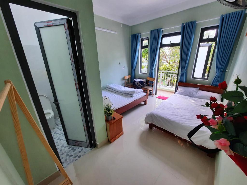 Ένα ή περισσότερα κρεβάτια σε δωμάτιο στο Minh Ngoc Homestay Citadelle