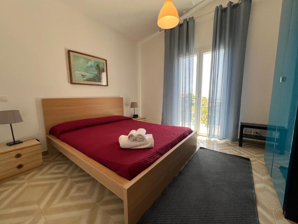 Postel nebo postele na pokoji v ubytování Terra Di Mare