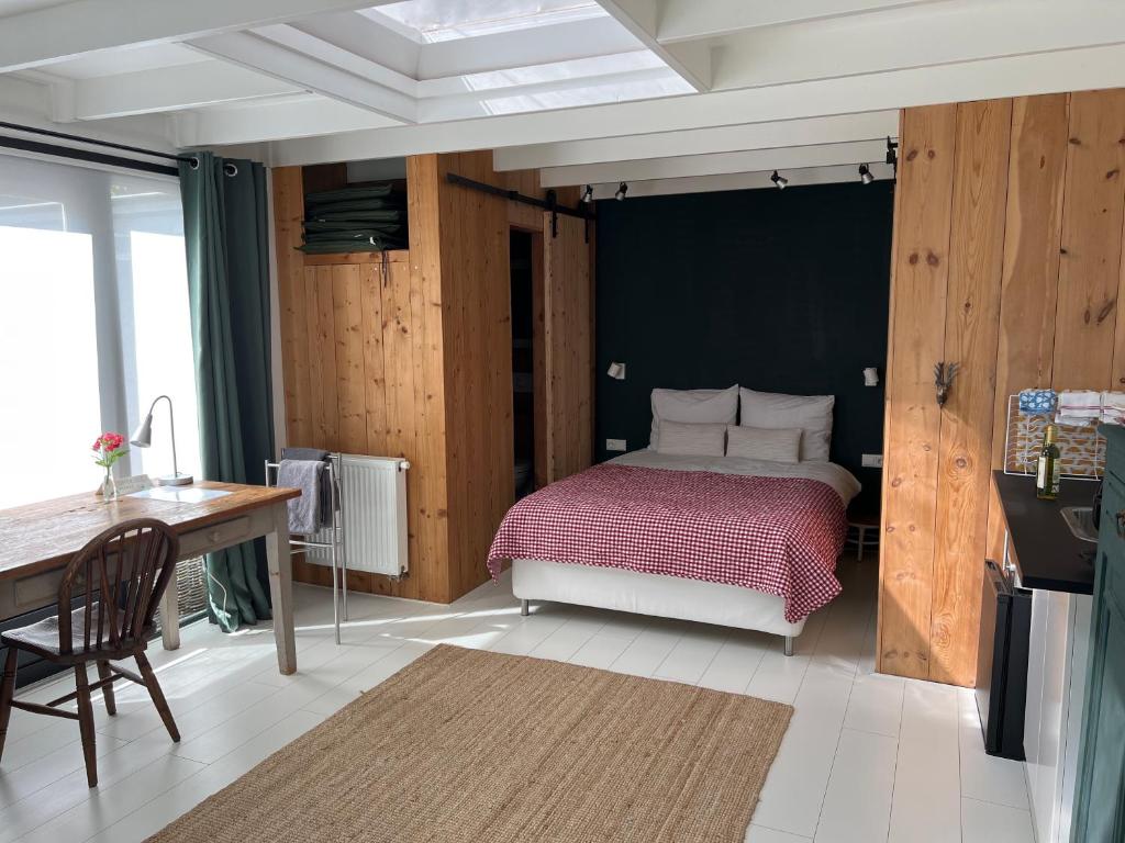 Ένα ή περισσότερα κρεβάτια σε δωμάτιο στο de Merel