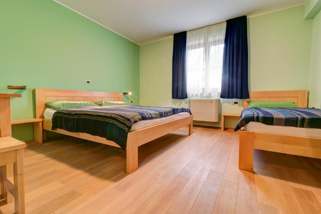 Postel nebo postele na pokoji v ubytování Homestead Vrbin