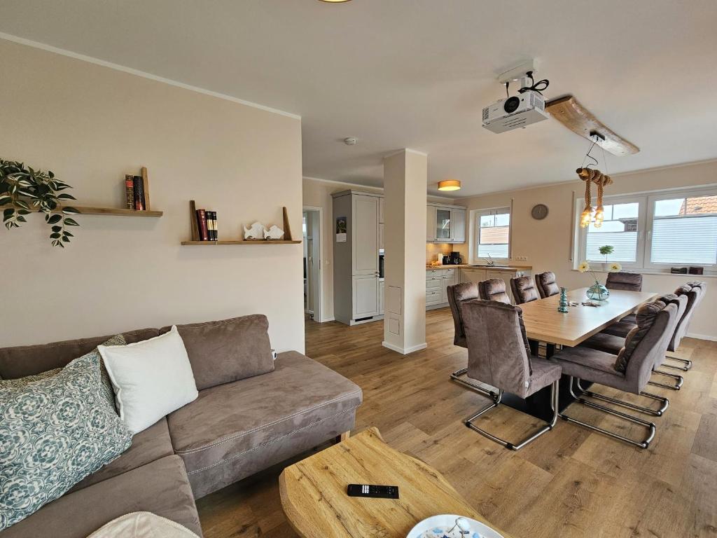 a living room with a couch and a table at Ferienhaus Xena in Biendorf