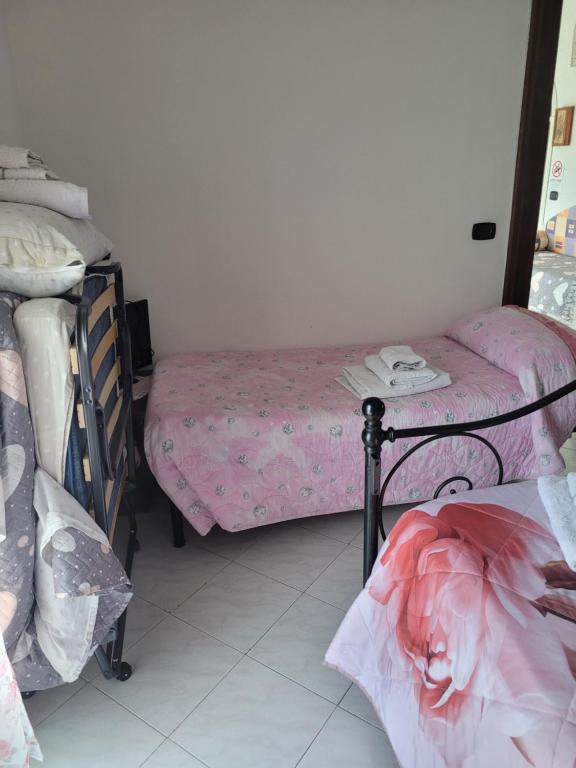 Postel nebo postele na pokoji v ubytování HOME di Pia