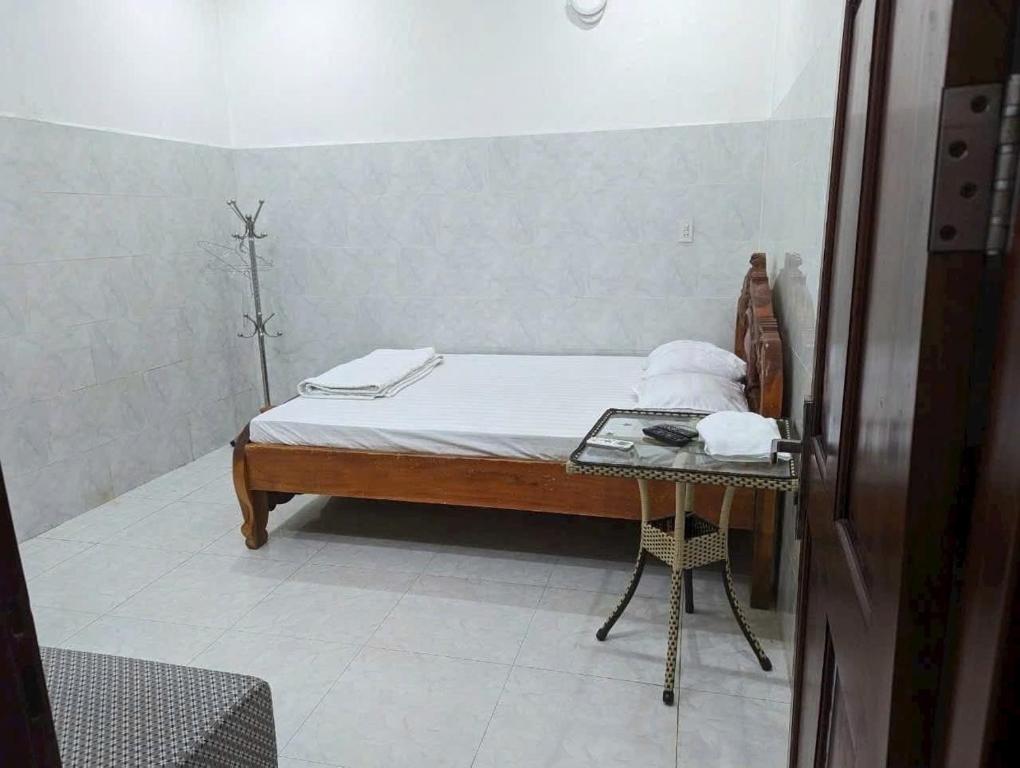 Postel nebo postele na pokoji v ubytování Nhà Nghỉ Mỹ Linh