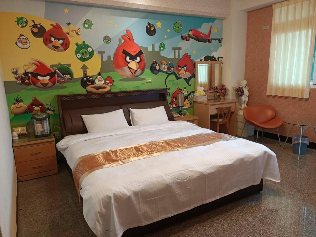 Postel nebo postele na pokoji v ubytování Jinge Guest House 集集金格民宿電動車充電站