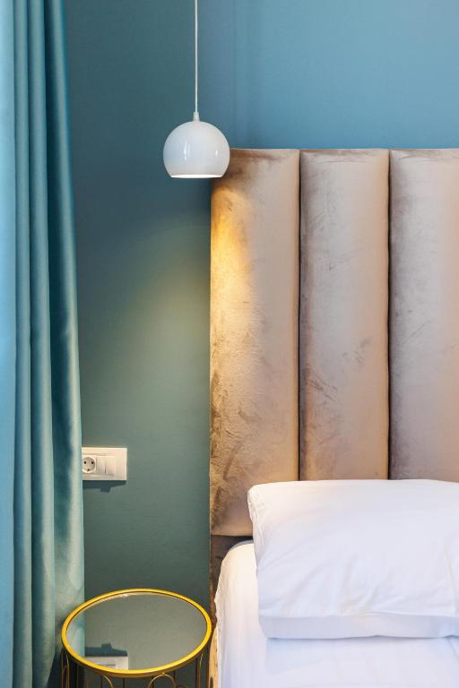 Postel nebo postele na pokoji v ubytování XIO Apartments